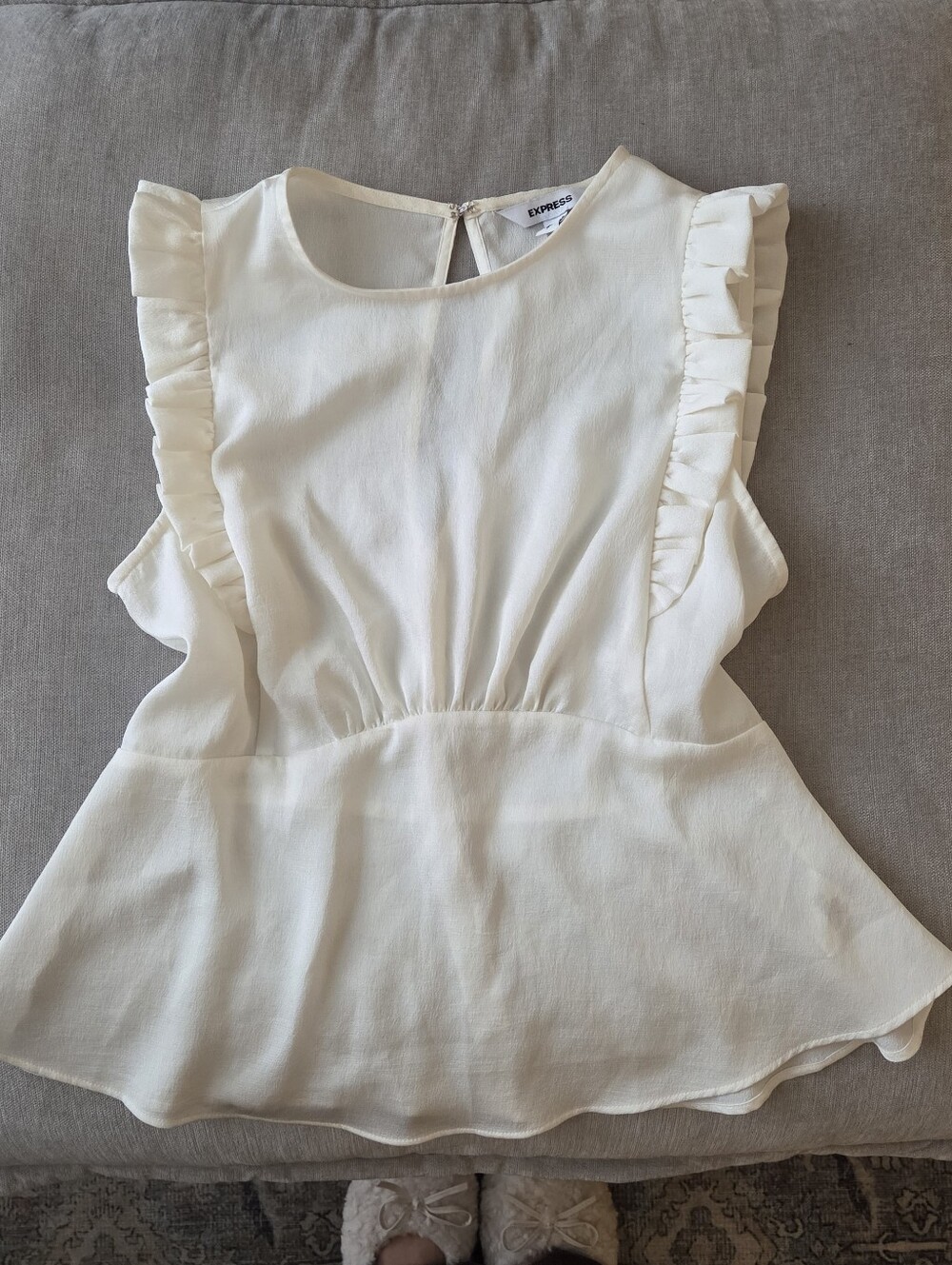 Express ivory/off-white sleeveless peplum blouse